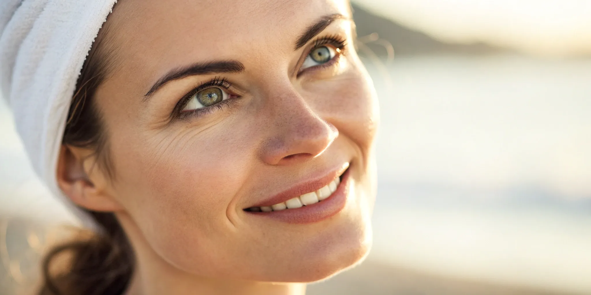 Smiling woman with healthy teeth after dental implants.