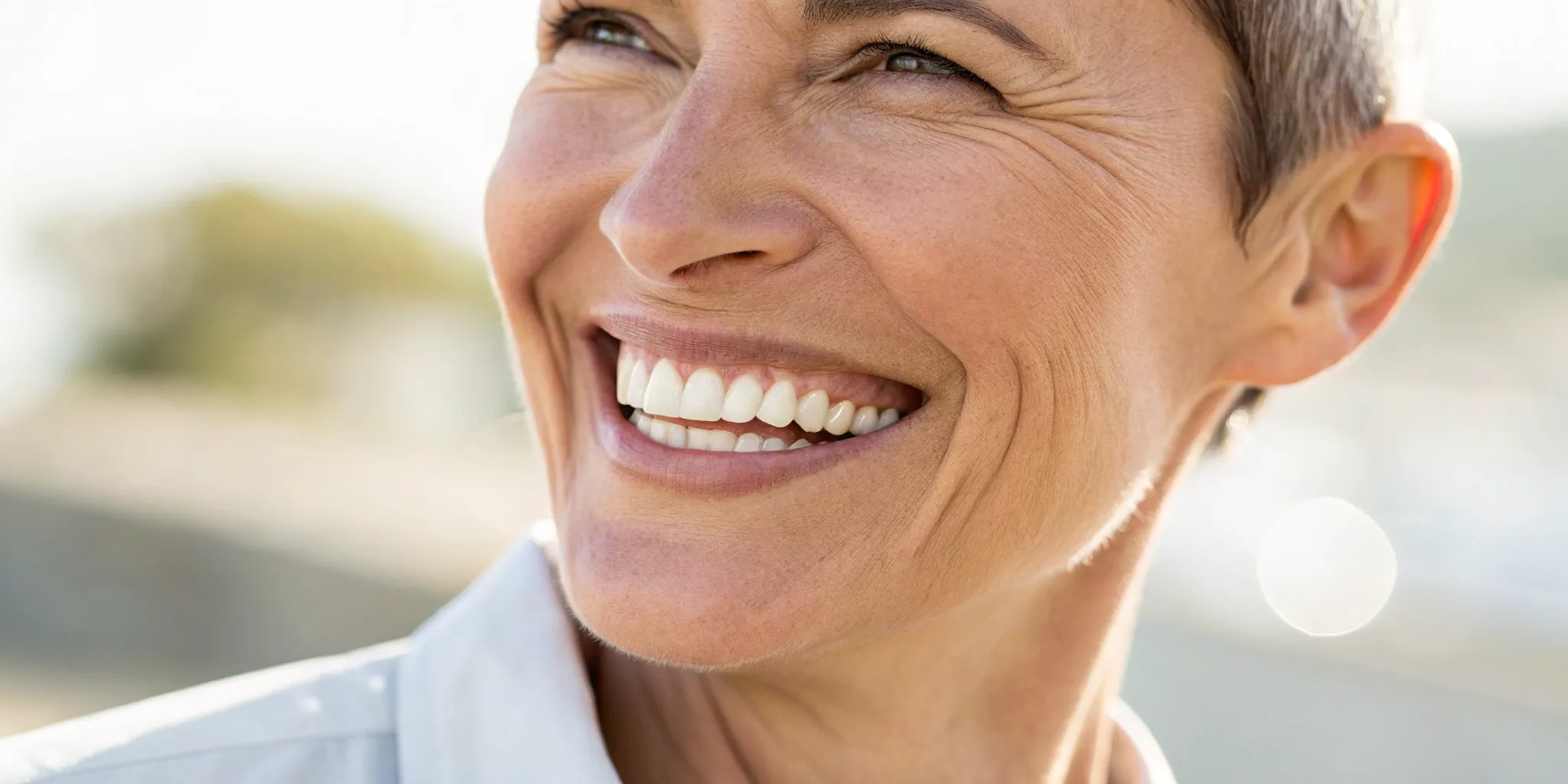 Healthy smile after same-day dental implants.